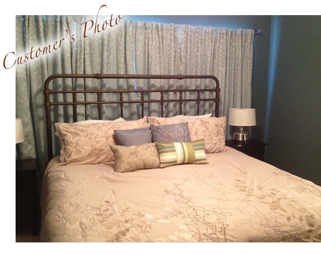 Bridget's cozy bedroom with bronze iron bed