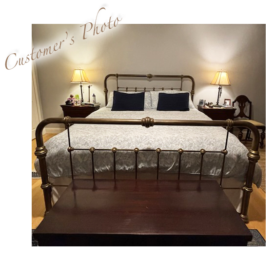 Chris's master bedroom with brass iron bed
