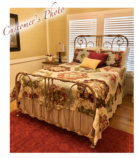 Charming bedroom with antique iron bed