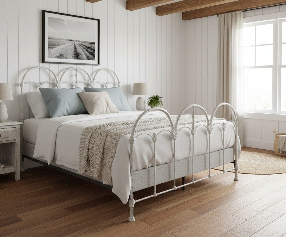 Handcrafted Castine iron bed frame with hand-poured structural castings and arched headboard design