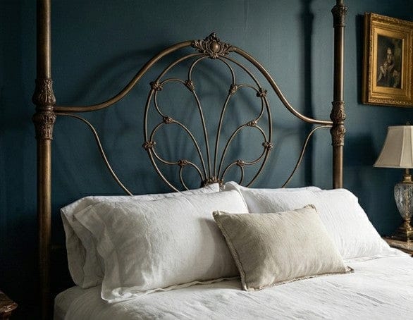 Morella handcrafted iron headboard with ornate scrollwork, decorative castings, and hand-applied finish