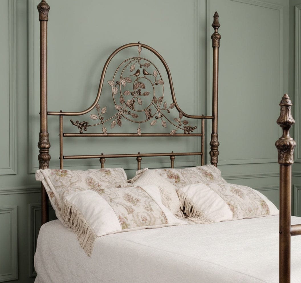 Ornate Victorian iron bed with tall headboard, decorative scrollwork, and hand-applied dark patina finish